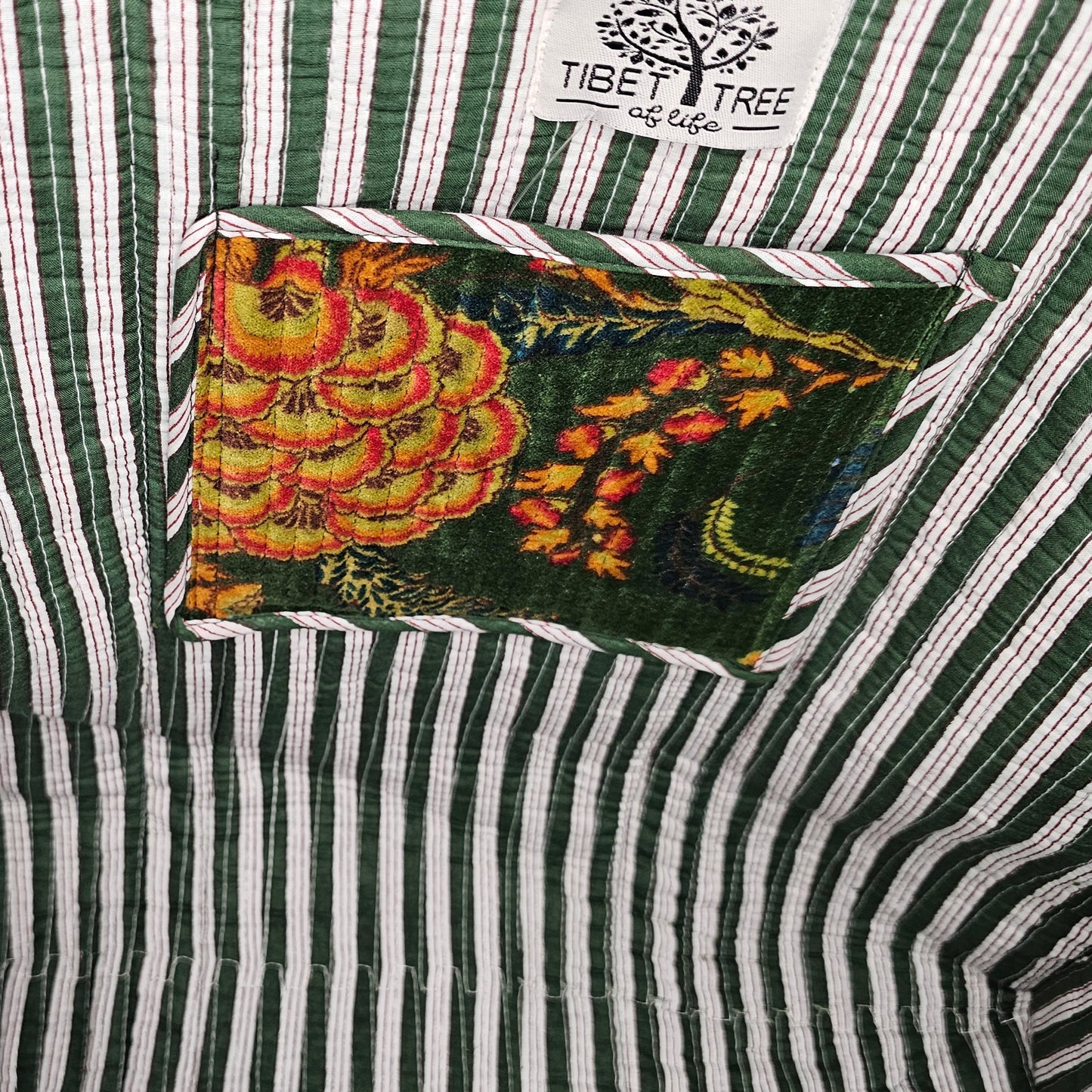 inside look at side profile on beach of green quilted big velvet tote bag Stripes white and green and tibet tree of life best tote bag high quality nice to the touch