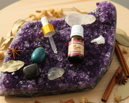 Cinnamon essential oil with the glass dropper and drop reducer on amethyst