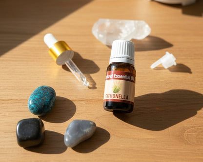Citronella essential oil with the glass dropper and drop reducer on amethyst