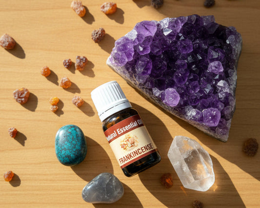 Frankincense essential oil bottle on a raw amethyst crystal