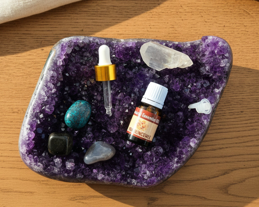 Frankincense essential oil with the glass dropper and drop reducer on amethyst