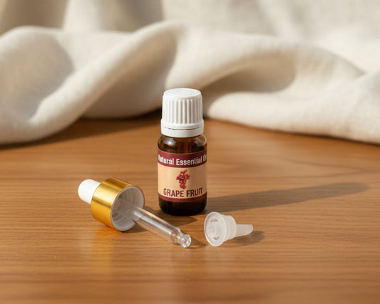 Grapefruit essential oil bottle with the glass pipette dropper and push-in drop reducer