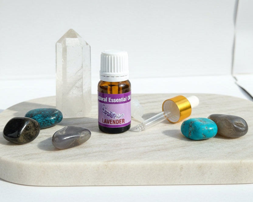 Lavender essential oil with the glass dropper and drop reducer on amethyst