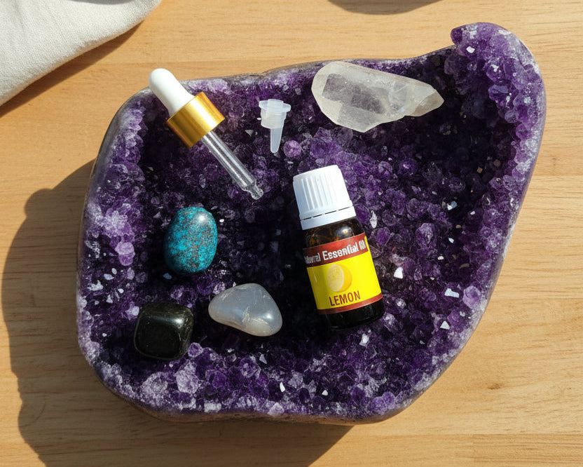 Lemon essential oil with the glass dropper and drop reducer on amethyst