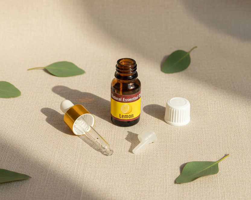 Lemon essential oil bottle with the glass pipette dropper and push-in drop reducer