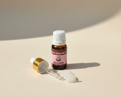 Rosemary essential oil bottle with the glass pipette dropper and push-in drop reducer